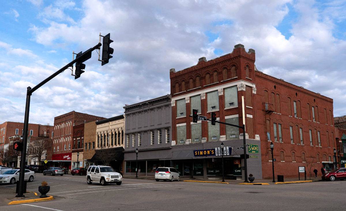 Street Corner, Showcasing Parked Cars and Buildings near the Riverfront area in Henderson, KY