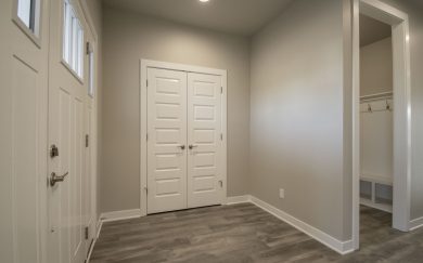 Foyer | Family Entry Foyer and family entry in the Emory Craftsman floor plan by Jagoe Homes, showcasing a welcoming family entrance from the garage with an optional drop zone for added organization and convenience.