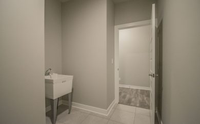 Laundry Room Laundry Room in the Emory Craftsman floor plan by Jagoe Homes, featuring a spacious layout with an optional laundry tub for added convenience.