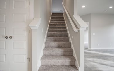 Stairs to Optional Bonus Stairs to the optional bonus room in the Emory Craftsman floor plan by Jagoe Homes, offering additional versatile space for various lifestyle needs
