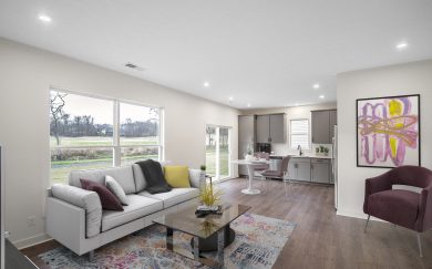 Furnished family room of the Angelico Craftsman floor plan by Jagoe Homes