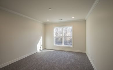 Owner&rsquo;s Suite with large windows in the Arizona Craftsman floor plan by Jagoe Homes, providing natural light and a spacious feel.