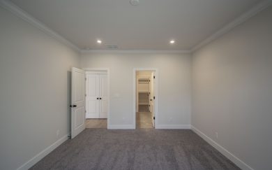 Owner&rsquo;s Suite with large windows in the Arizona Craftsman floor plan by Jagoe Homes, providing natural light and a spacious feel.