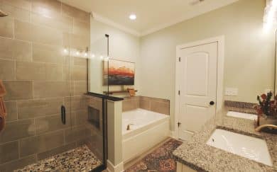Owner's Deluxe Bath Owner’s deluxe bath featuring a soaking tub, walk-in ceramic shower, and double bowl vanity with granite countertops in the Carolina Craftsman floor plan by Jagoe Homes.