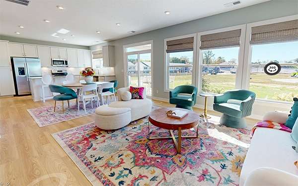 A Cozy Living Room Adorned with a Colorful Rug and Chairs in Magnolia Hills of Cumberland